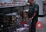 Image of Personnel buy food items Saigon Vietnam, 1965, second 12 stock footage video 65675069607