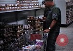 Image of Personnel buy food items Saigon Vietnam, 1965, second 13 stock footage video 65675069607