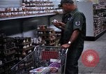 Image of Personnel buy food items Saigon Vietnam, 1965, second 14 stock footage video 65675069607