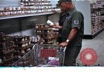 Image of Personnel buy food items Saigon Vietnam, 1965, second 15 stock footage video 65675069607