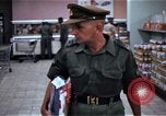 Image of Personnel buy food items Saigon Vietnam, 1965, second 32 stock footage video 65675069607