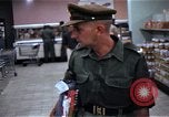 Image of Personnel buy food items Saigon Vietnam, 1965, second 33 stock footage video 65675069607