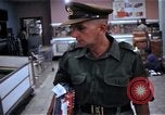 Image of Personnel buy food items Saigon Vietnam, 1965, second 34 stock footage video 65675069607