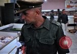 Image of Personnel buy food items Saigon Vietnam, 1965, second 36 stock footage video 65675069607