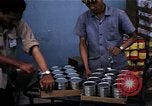 Image of Personnel buy food items Saigon Vietnam, 1965, second 55 stock footage video 65675069607
