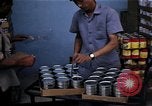 Image of Personnel buy food items Saigon Vietnam, 1965, second 56 stock footage video 65675069607
