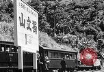 Standbild Dampflokomotive ein Zug nach hinten schieben Taiwan, 1940, aus Sekunde 48 historischem Filmmaterial Videoclip 65675069924