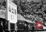 Standbild Dampflokomotive ein Zug nach hinten schieben Taiwan, 1940, aus Sekunde 50 historischem Filmmaterial Videoclip 65675069924