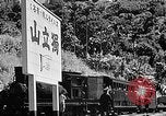 Standbild Dampflokomotive ein Zug nach hinten schieben Taiwan, 1940, aus Sekunde 58 historischem Filmmaterial Videoclip 65675069924