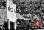 Standbild Dampflokomotive ein Zug nach hinten schieben Taiwan, 1940, aus Sekunde 59 historischem Filmmaterial Videoclip 65675069924
