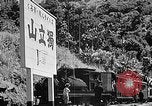 Standbild Dampflokomotive ein Zug nach hinten schieben Taiwan, 1940, aus Sekunde 61 historischem Filmmaterial Videoclip 65675069924