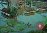 Immagine di Il fiume Mekong inondazioni città di Chau Doc in Vietnam durante la Guerra del Vietnam Chau Doc Vietnam del Sud, 1966, secondo 13 filmato di repertorio 65675069969