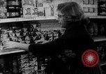 Image of bare shelves at supermarket United States USA, 1962, second 16 stock footage video 65675070172