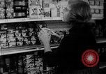 Image of bare shelves at supermarket United States USA, 1962, second 17 stock footage video 65675070172
