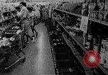 Image of bare shelves at supermarket United States USA, 1962, second 19 stock footage video 65675070172