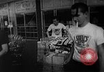 Image of bare shelves at supermarket United States USA, 1962, second 39 stock footage video 65675070172