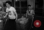Image of bare shelves at supermarket United States USA, 1962, second 41 stock footage video 65675070172