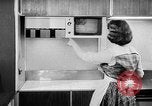 Image of modern kitchen New York City USA, 1954, second 59 stock footage video 65675070193