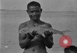 Image of fishermen Hawaii USA, 1924, second 43 stock footage video 65675070227