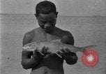 Image of fishermen Hawaii USA, 1924, second 44 stock footage video 65675070227