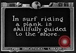 Image of Hawaiian people surfing Honolulu Hawaii USA, 1924, second 29 stock footage video 65675070228