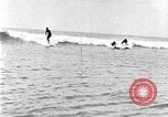Image of Hawaiian people surfing Honolulu Hawaii USA, 1924, second 31 stock footage video 65675070228