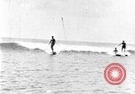 Image of Hawaiian people surfing Honolulu Hawaii USA, 1924, second 32 stock footage video 65675070228