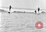 Image of Hawaiian people surfing Honolulu Hawaii USA, 1924, second 33 stock footage video 65675070228