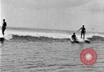 Image of Hawaiian people surfing Honolulu Hawaii USA, 1924, second 34 stock footage video 65675070228