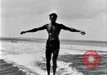 Image of Hawaiian people surfing Honolulu Hawaii USA, 1924, second 35 stock footage video 65675070228