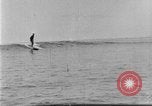 Image of Hawaiian people surfing Honolulu Hawaii USA, 1924, second 38 stock footage video 65675070228