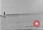 Image of Hawaiian people surfing Honolulu Hawaii USA, 1924, second 39 stock footage video 65675070228