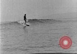 Image of Hawaiian people surfing Honolulu Hawaii USA, 1924, second 41 stock footage video 65675070228