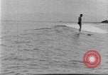 Image of Hawaiian people surfing Honolulu Hawaii USA, 1924, second 43 stock footage video 65675070228