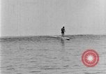 Image of Hawaiian people surfing Honolulu Hawaii USA, 1924, second 47 stock footage video 65675070228