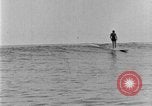 Image of Hawaiian people surfing Honolulu Hawaii USA, 1924, second 48 stock footage video 65675070228