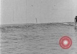 Image of Hawaiian people surfing Honolulu Hawaii USA, 1924, second 49 stock footage video 65675070228