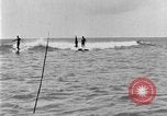 Image of Hawaiian people surfing Honolulu Hawaii USA, 1924, second 51 stock footage video 65675070228