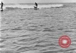 Image of Hawaiian people surfing Honolulu Hawaii USA, 1924, second 52 stock footage video 65675070228