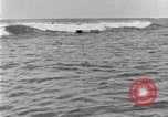 Image of Hawaiian people surfing Honolulu Hawaii USA, 1924, second 54 stock footage video 65675070228
