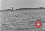 Image of Hawaiian people surfing Honolulu Hawaii USA, 1924, second 57 stock footage video 65675070228