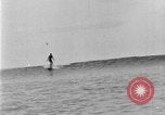 Image of Hawaiian people surfing Honolulu Hawaii USA, 1924, second 58 stock footage video 65675070228