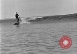 Image of Hawaiian people surfing Honolulu Hawaii USA, 1924, second 61 stock footage video 65675070228