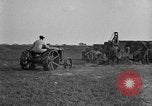 Image of tractor-drawn wagon United States USA, 1919, second 54 stock footage video 65675070231