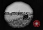 Image of tractor-drawn binder United States USA, 1919, second 1 stock footage video 65675070232