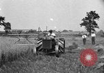 Image of tractor-drawn binder United States USA, 1919, second 6 stock footage video 65675070232