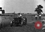 Image of tractor-drawn binder United States USA, 1919, second 7 stock footage video 65675070232