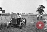 Image of tractor-drawn binder United States USA, 1919, second 8 stock footage video 65675070232