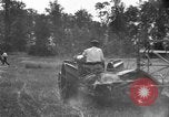 Image of tractor-drawn binder United States USA, 1919, second 14 stock footage video 65675070232