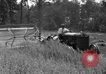 Image of tractor-drawn binder United States USA, 1919, second 30 stock footage video 65675070232